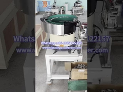 Watch the Vibratory Bowl Feeder Feeding Square Metal Parts